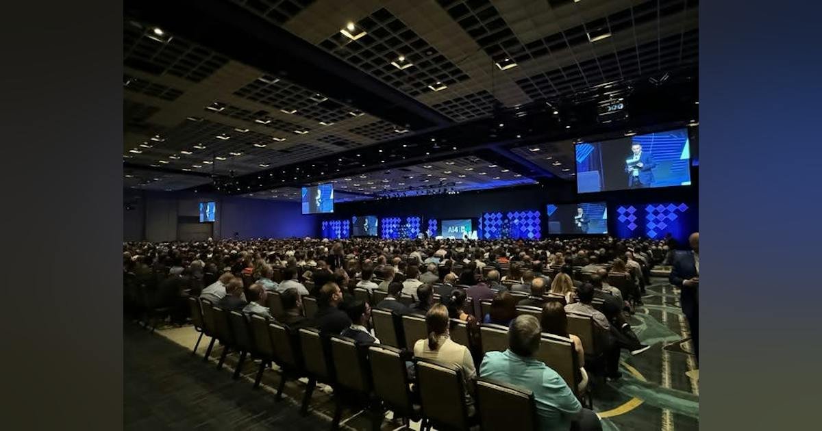 Ai4 conference audience facing a branded stage